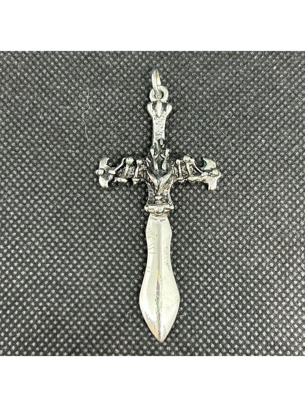 Dagger and cross pendant